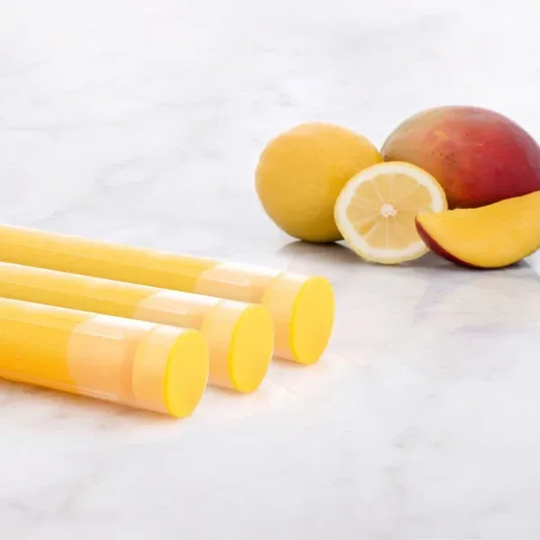 Aroma Sense Handheld cartridges with sliced mango in the background